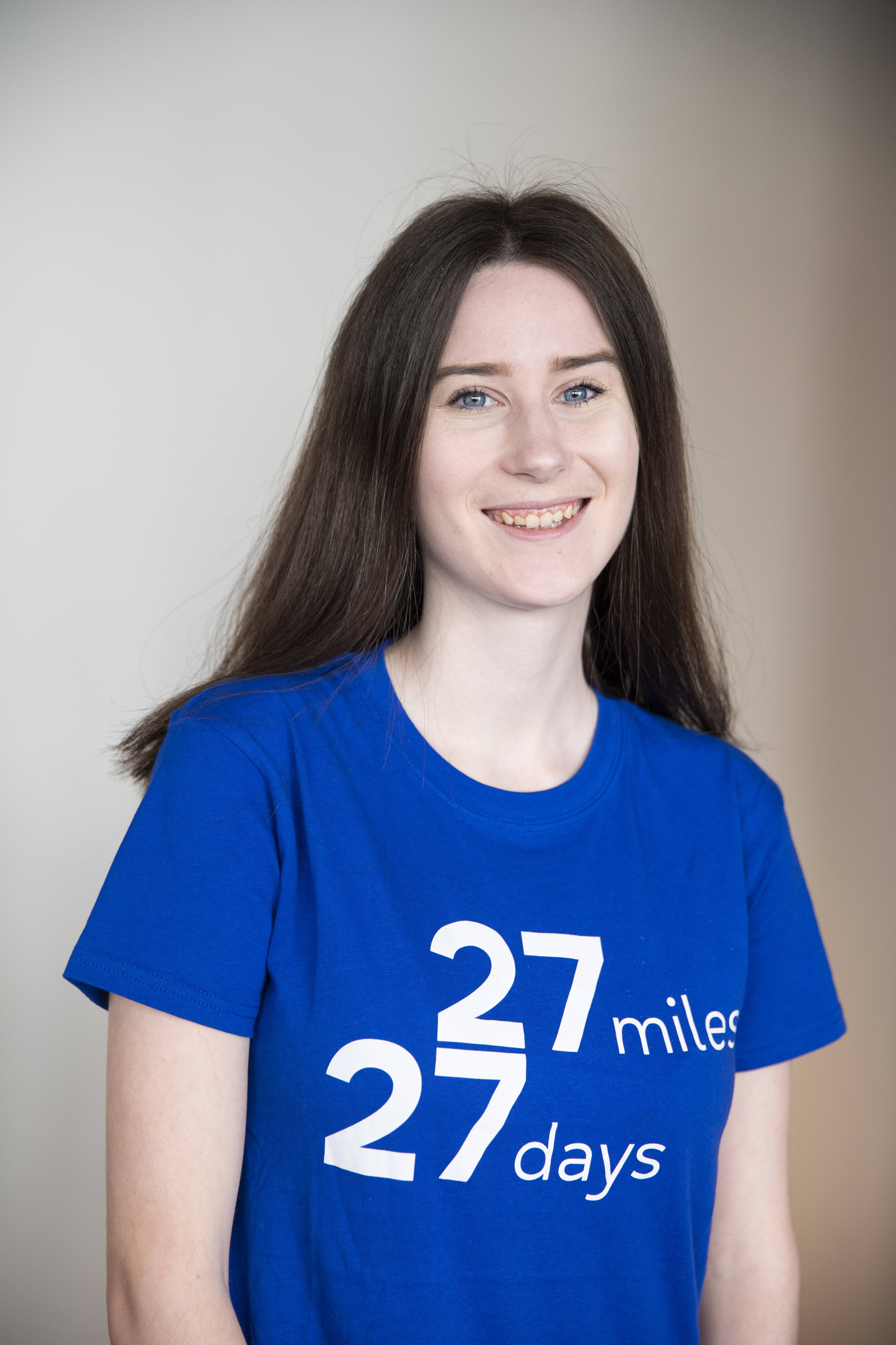 Person looking at the camera wearing a 27 27 t-shirt 