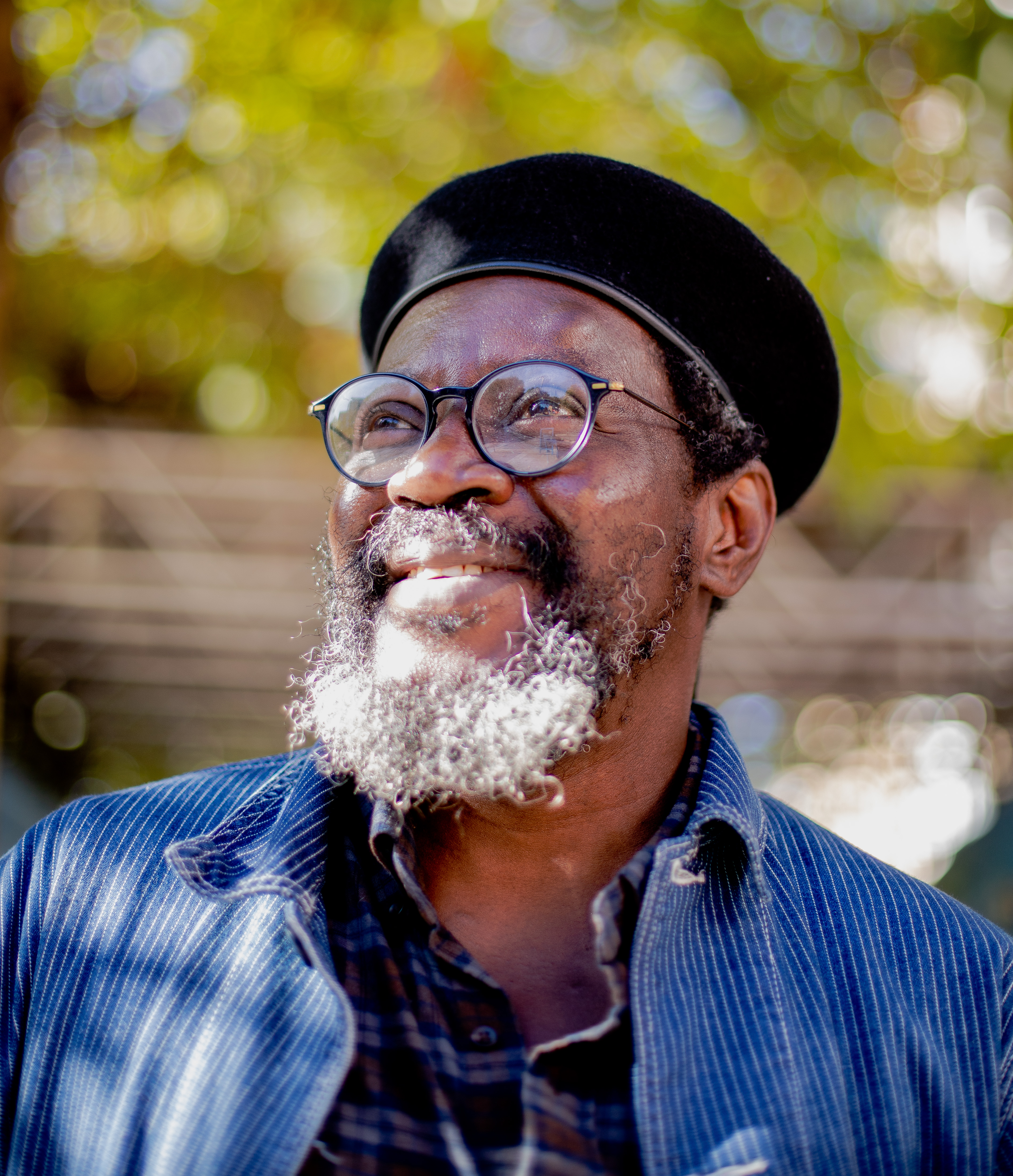 Man looking sideways slightly smiling