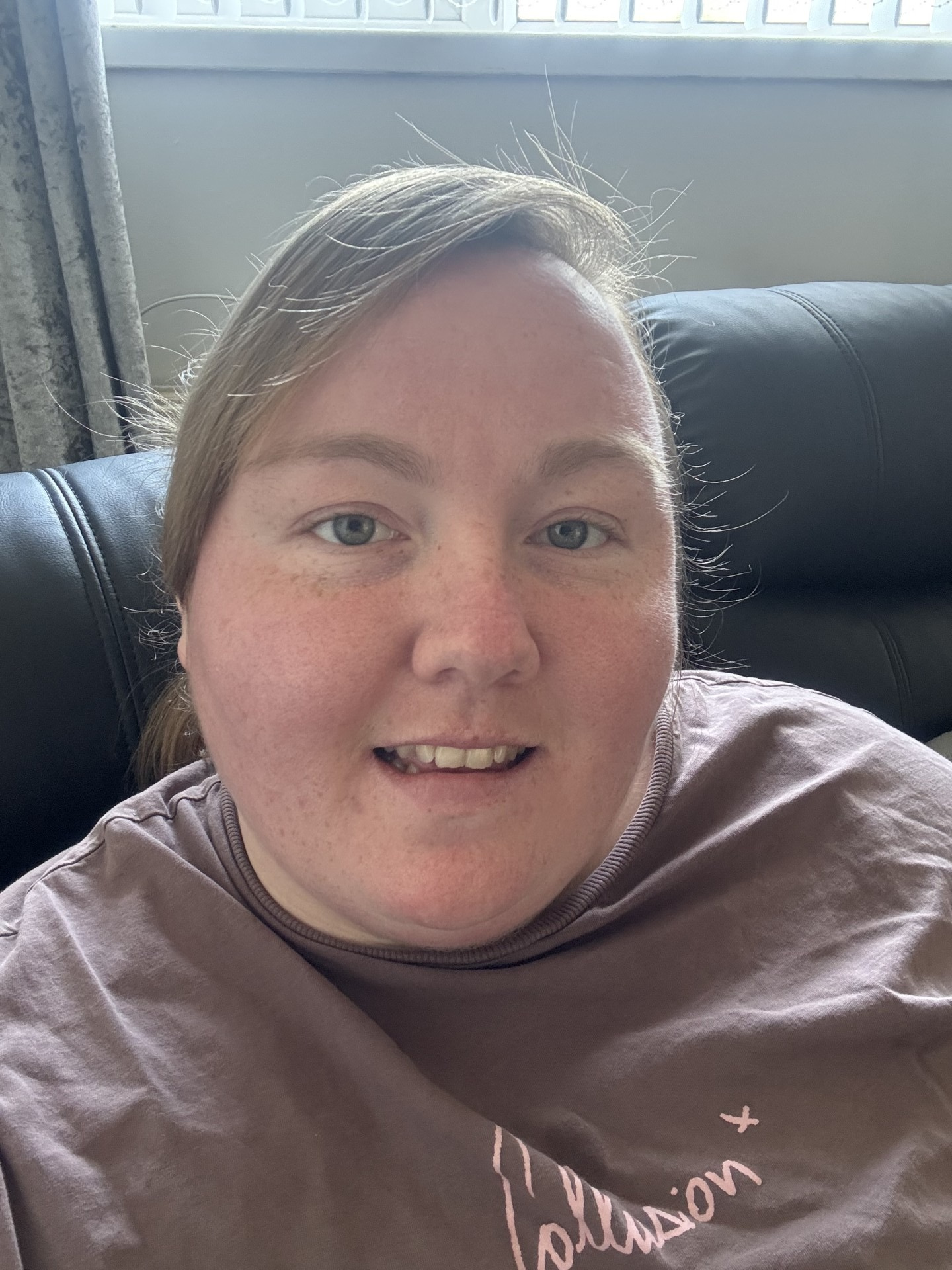 Person sitting on sofa looking at the camera