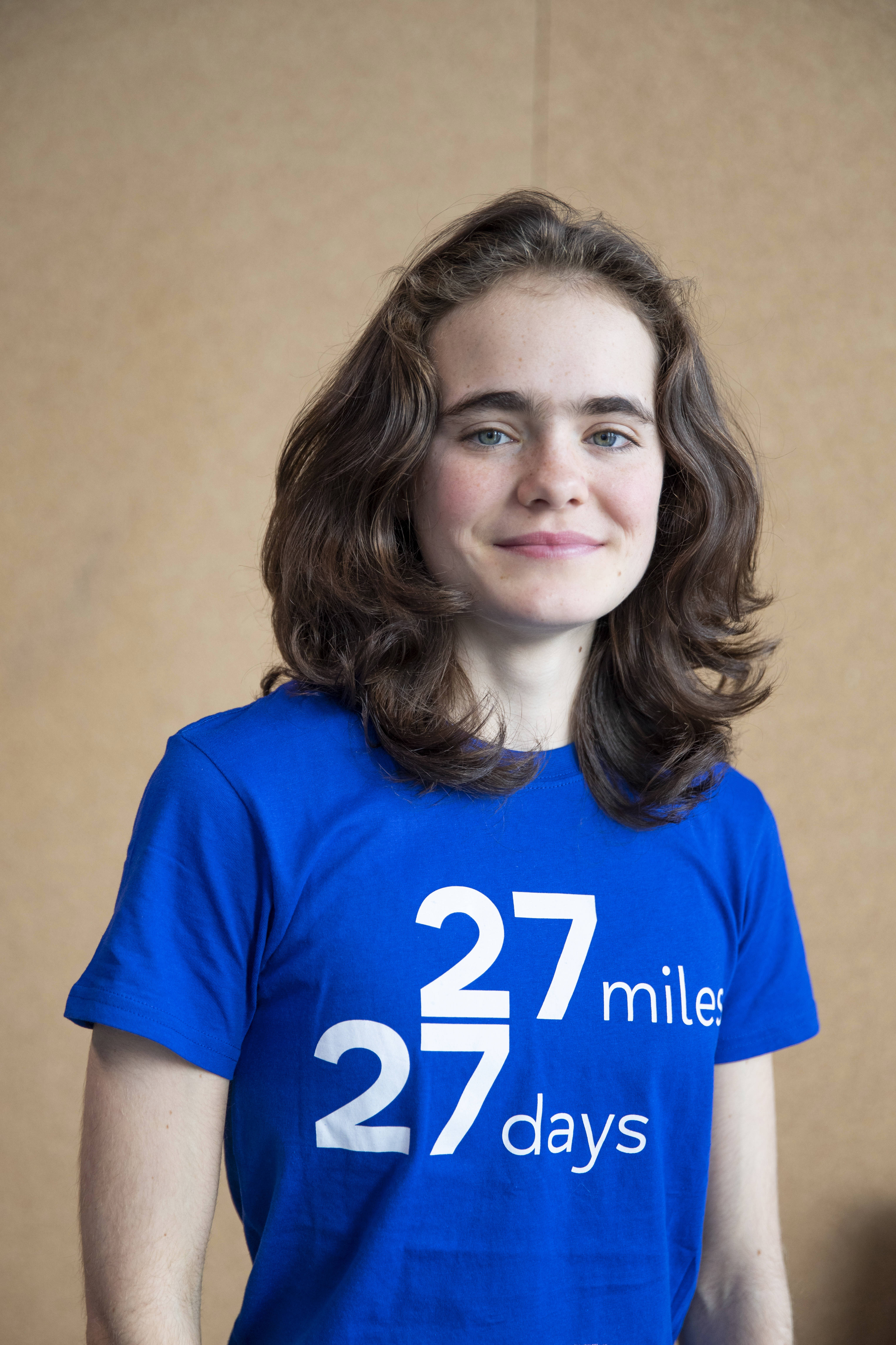 Person looking at the camera wearing a 27 27 t-shirt 