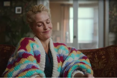 Gillian Anderson as Dr Jean Milburn in Netflix show Sex Education, wears a knitted striped jumper. 